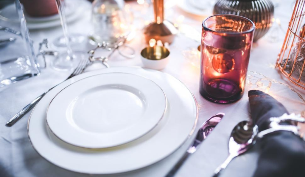 Close-up of a clean porcelain plate with food placed on the surface.